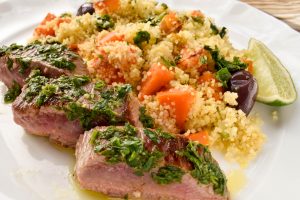 Herbed lamb backstraps with roast vegetable cous cous