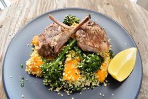 Lamb ‘a scottadito’ (cutlets) served with roasted pumpkin (squash) and broccolini couscous