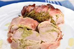 Pancetta wrapped roast pork fillet with salsa verde stuffing