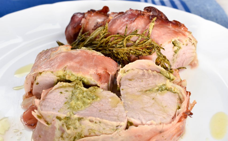 Pancetta wrapped roast pork fillet with salsa verde stuffing