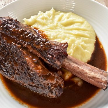 Slow cooked beef short ribs in red wine sauce