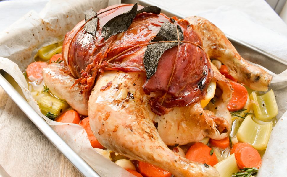 Roast chicken wrapped in sage and prosciutto