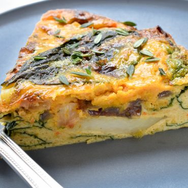 Frittata of creamed pumpkin, potato and baby spinach