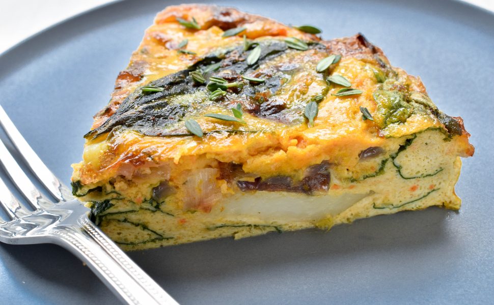 Frittata of creamed pumpkin, potato and baby spinach