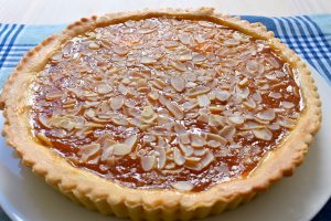 Apricot jam and flaked almond tart