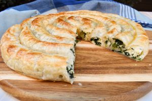 Rolled puff pastry with spinach and ricotta filling