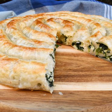 Rolled puff pastry with spinach and ricotta filling