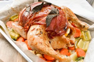 Roast chicken wrapped in sage and prosciutto